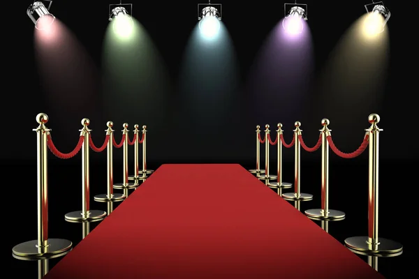 Red carpet and rope barrier with shining spotlights — Stock Photo, Image