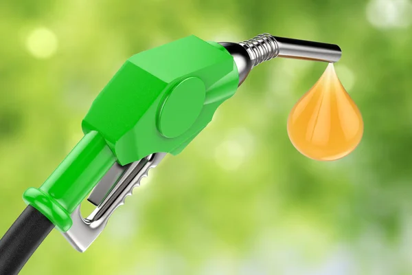 Green gas pump nozzle with droplet of oil — Stock Photo, Image