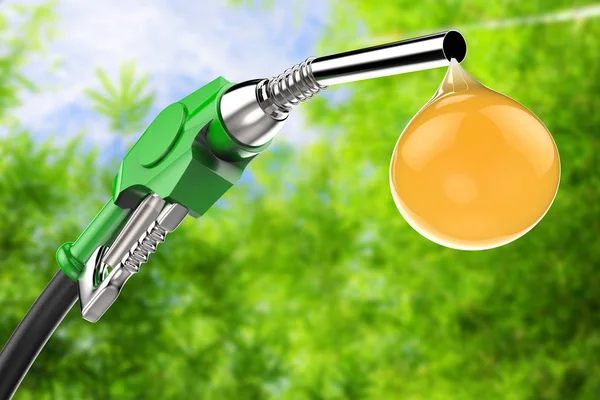 green gas pump nozzle with droplet of oil