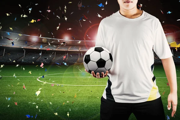 Player holding ball with stadium background — Stock Photo, Image