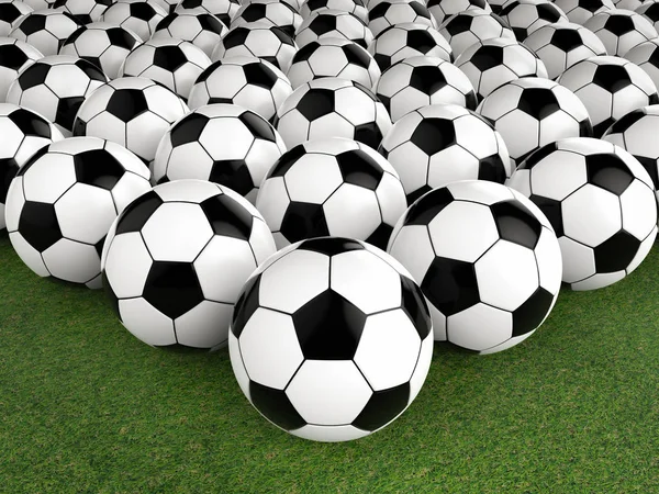 Group of soccer balls on green field — Stock Photo, Image