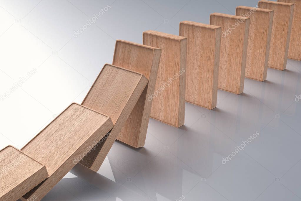 wooden dominoes falling