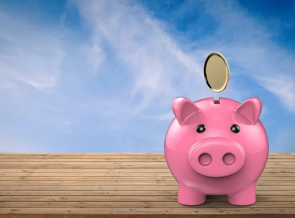 Piggy bank met gouden munten die vallen — Stockfoto