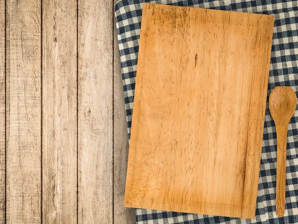 Wooden chopping board with spoon — Stock Photo, Image