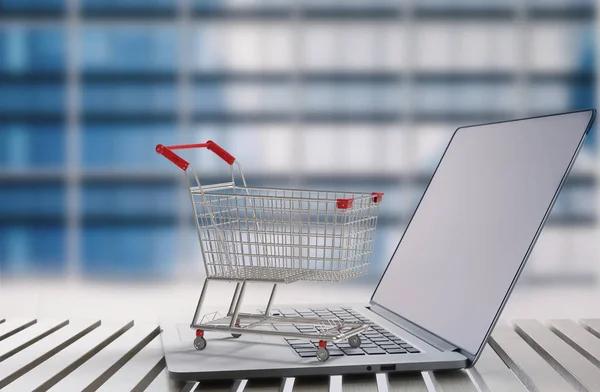 Concepto de compras en línea con carrito de compras en el teclado —  Fotos de Stock