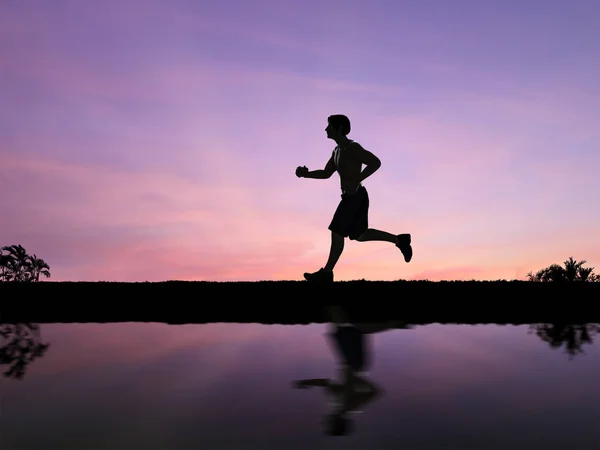 Silhouette man jogging — Stock Photo, Image