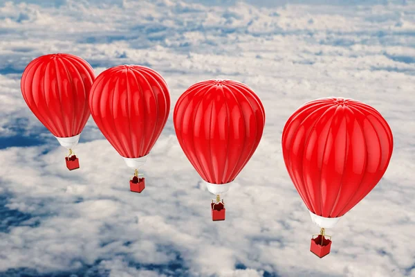 Red hot air balloons flying above cloudy sky — Stock Photo, Image
