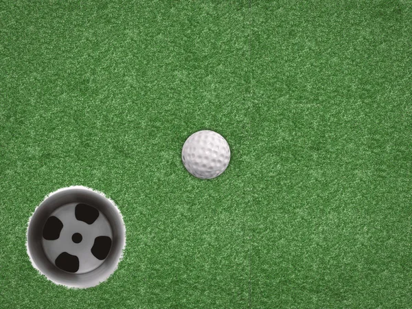 Bola de golfe com copo de golfe no fundo verde — Fotografia de Stock