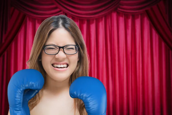 woman fighting with blue boxing gloves