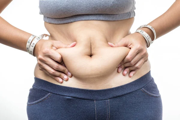 Mulher com excesso de peso com mão segurando barriga gorda — Fotografia de Stock