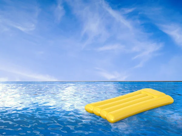 Yellow raft on infinity pool — Stock Photo, Image