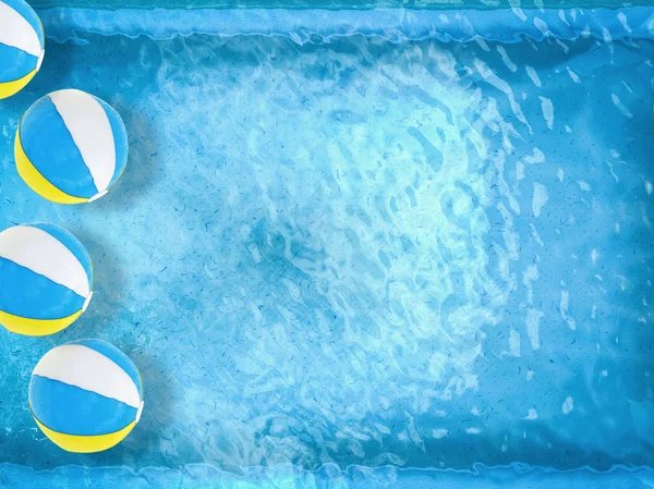 Beach balls floating on pool — Stock Photo, Image