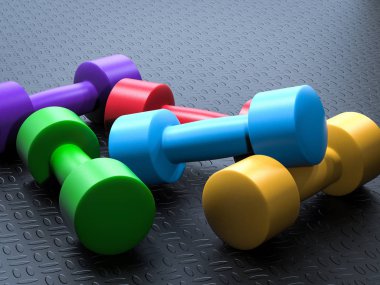 renkli dumbbells yığını 