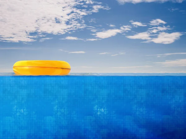 Pool side view with yellow swim ring — Stock Photo, Image