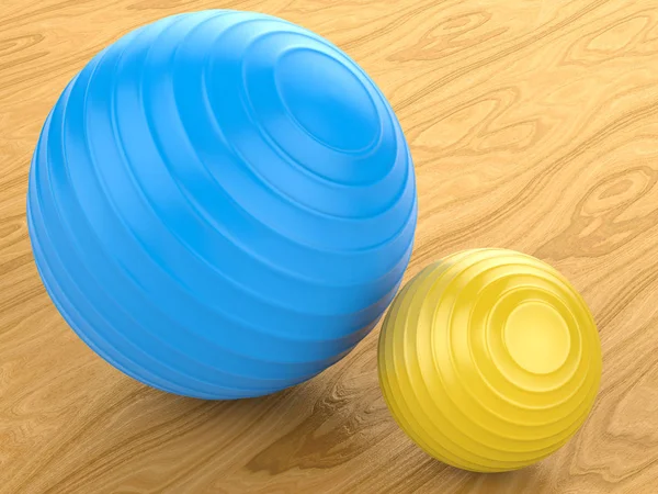 Blauwe en gele fitness ballen — Stockfoto