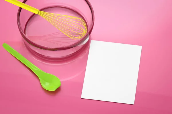 Blank paper with wire whisk in a bowl — Stock Photo, Image