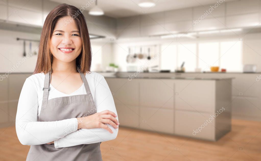 asian housekeeper in kitchen