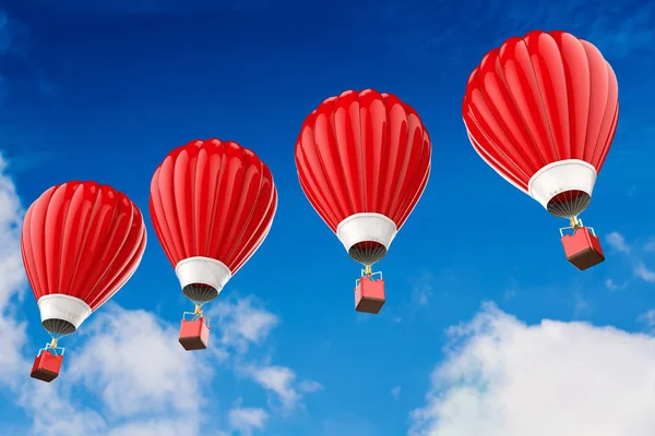 Balões de ar quente vermelho voando acima do céu nublado — Fotografia de Stock