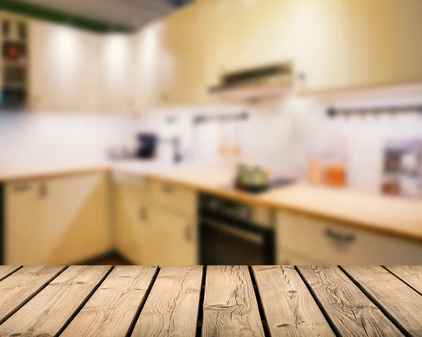 Wooden counter top with kitchen background — Stock Photo, Image