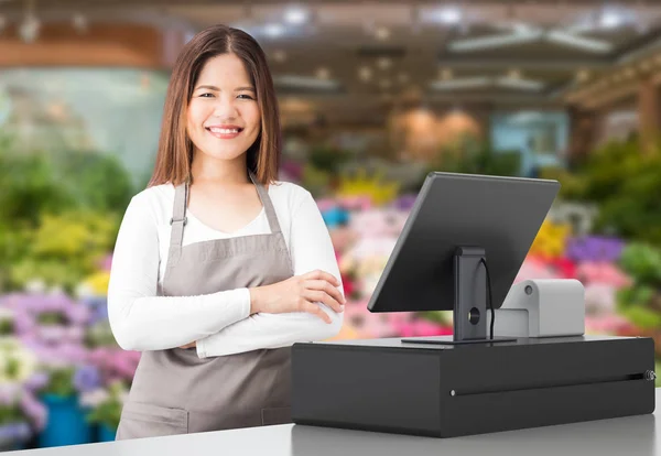 asian worker with cashier desk
