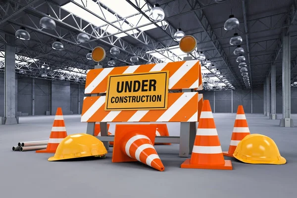 under construction sign with barrier and cones