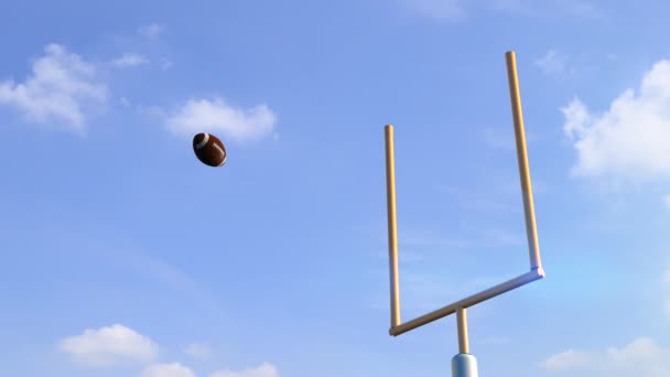 American football ball through goal post — Stock Video