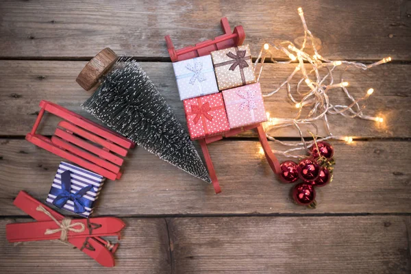 Christmas decorations on aged wooden background — Stock Photo, Image