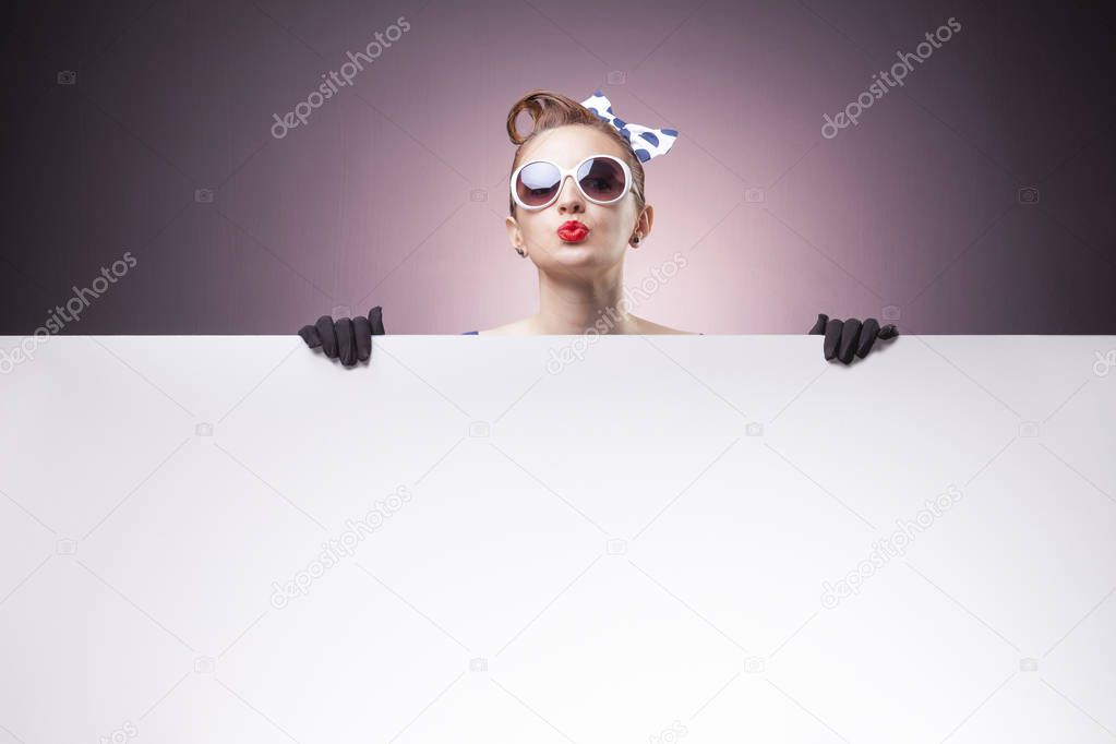 Pin Up girl holding a white board 