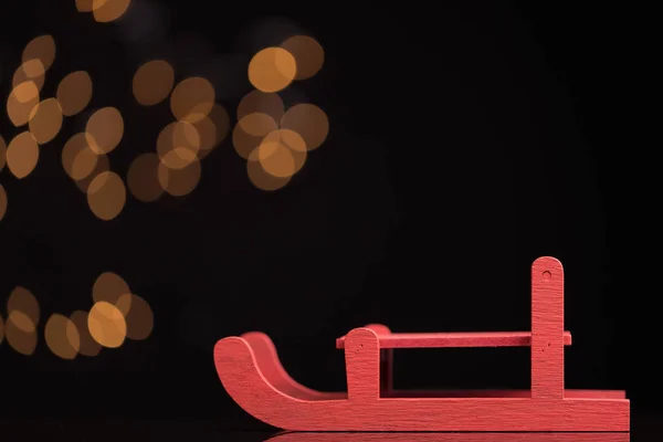Red sled on dark background — Stock Photo, Image