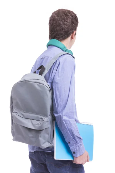 Teenager student carrying textbook and backpack — Stock Photo, Image