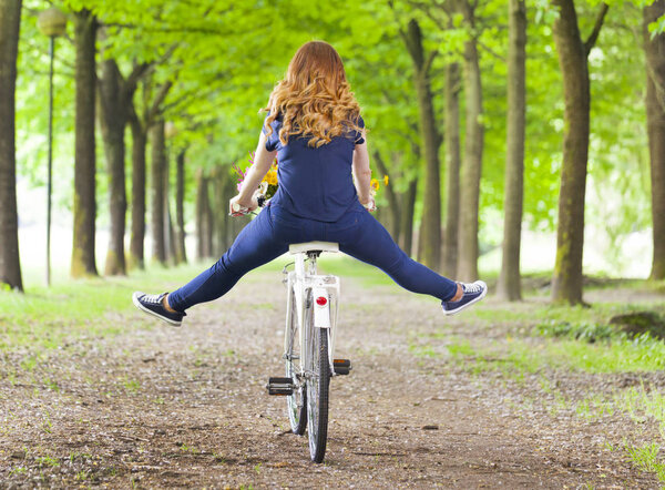 woman riding a bike at the park 
