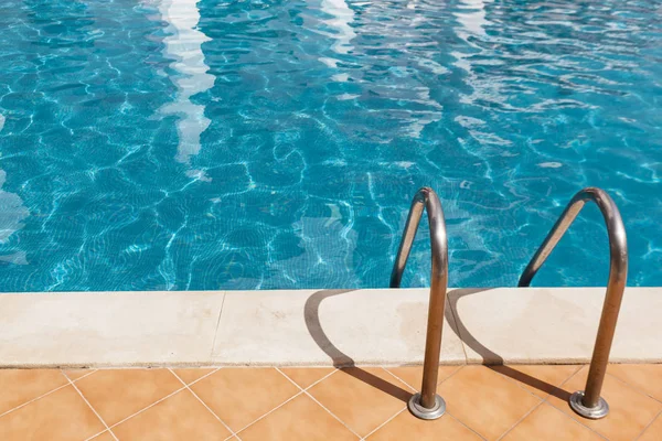 Swimming pool with ladder — Stock Photo, Image