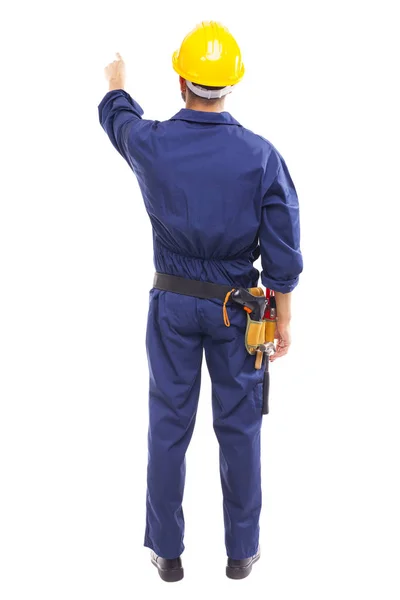 Back view of a young worker pointing — Stock Photo, Image