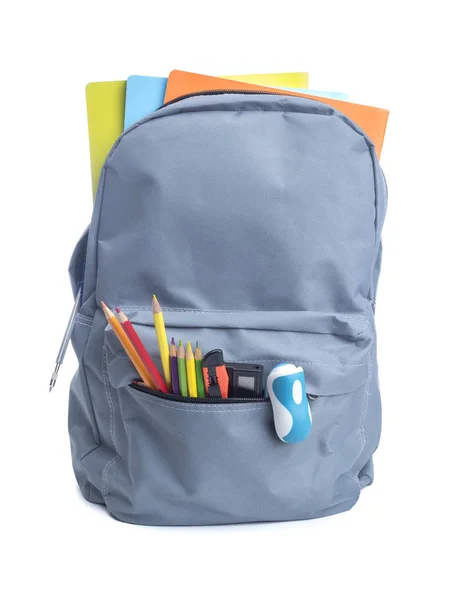 Серый рюкзак со школьными принадлежностями — стоковое фото
