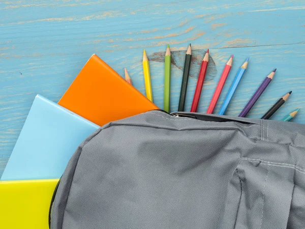 School backpack on wooden background — Stock Photo, Image