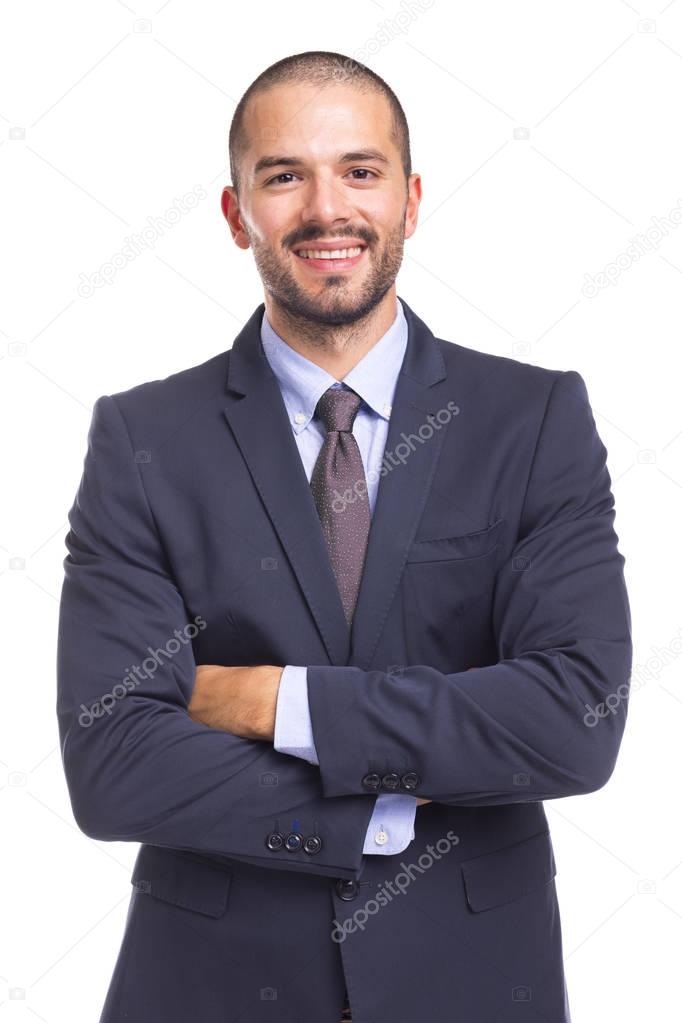 Handsome smiling businessman with arms crossed