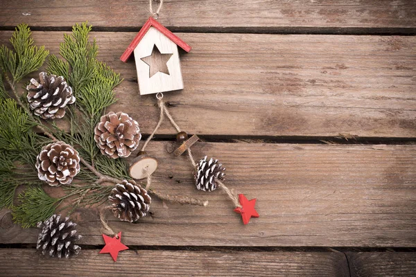 Christmas decoration on aged wooden table — Stock Photo, Image