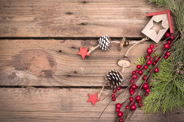 Christmas decoration on aged wooden background — Stock Photo, Image