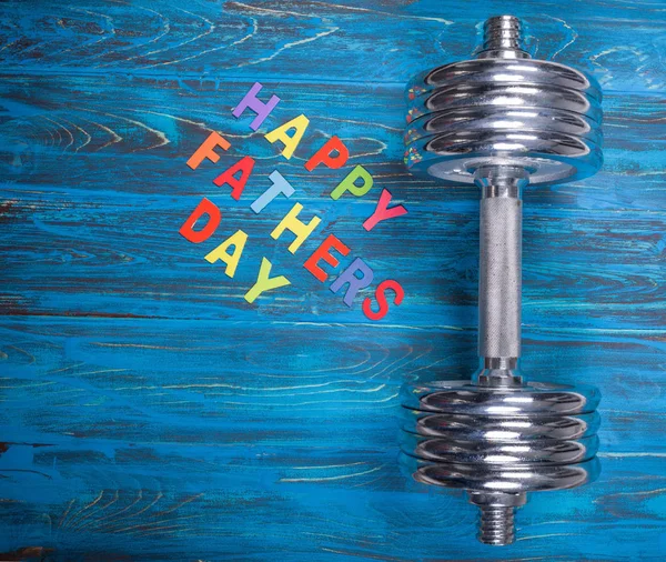 Happy Father Day Inscription Dumbbell Wooden Background — стоковое фото