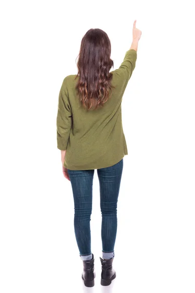 一个年轻女孩的背影指向 孤立在一个白色的背景 — 图库照片