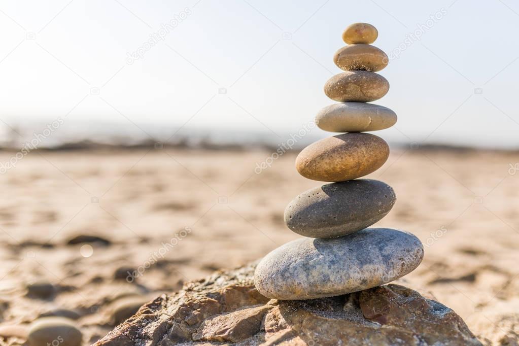 Pyramid of stones on the beach close up