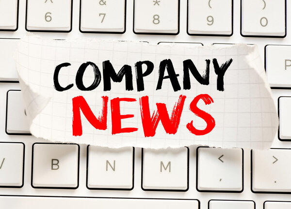 Company news card on the keyboard