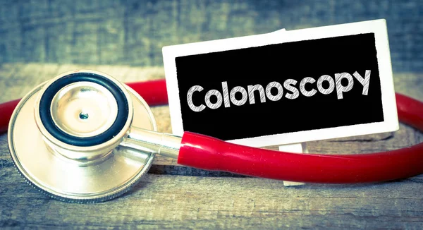 Kolonoskopia napis przez stetoskop — Zdjęcie stockowe