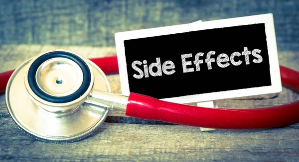 Side effects inscription by stethoscope — Stock Photo, Image