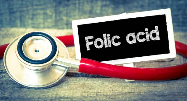 Folic acid inscription by stethoscope — Stock Photo, Image