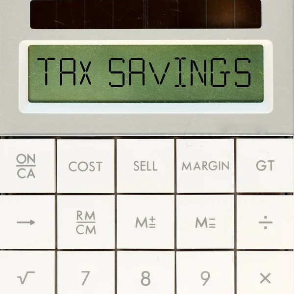 Kalkulačka s textem daňové úspory — Stock fotografie