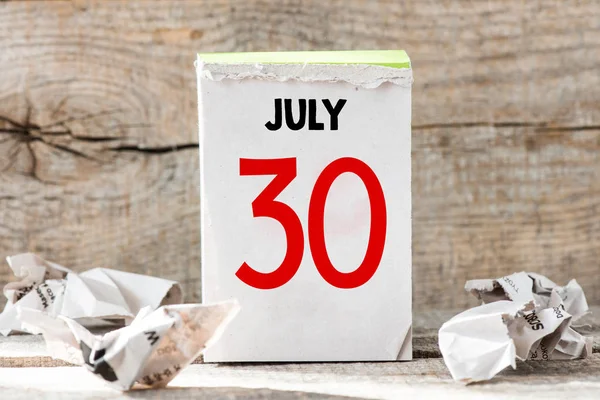 30 of July calendar with crumpled papers