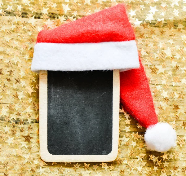 Santas hat on small blackboard — Stock Photo, Image