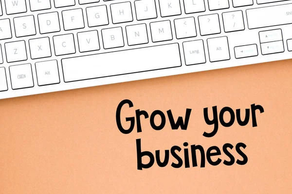 Grow your business text on notepad