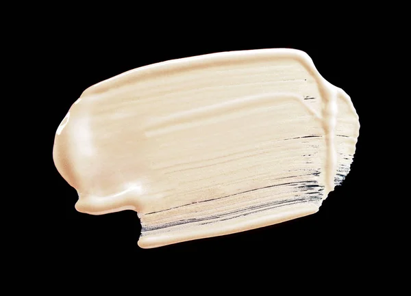 Smudged liquid foundation isolated on black — Stock Photo, Image